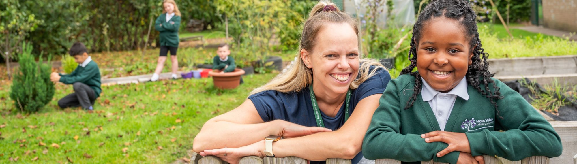 Moss Valley pupils and teacher in the school grounds