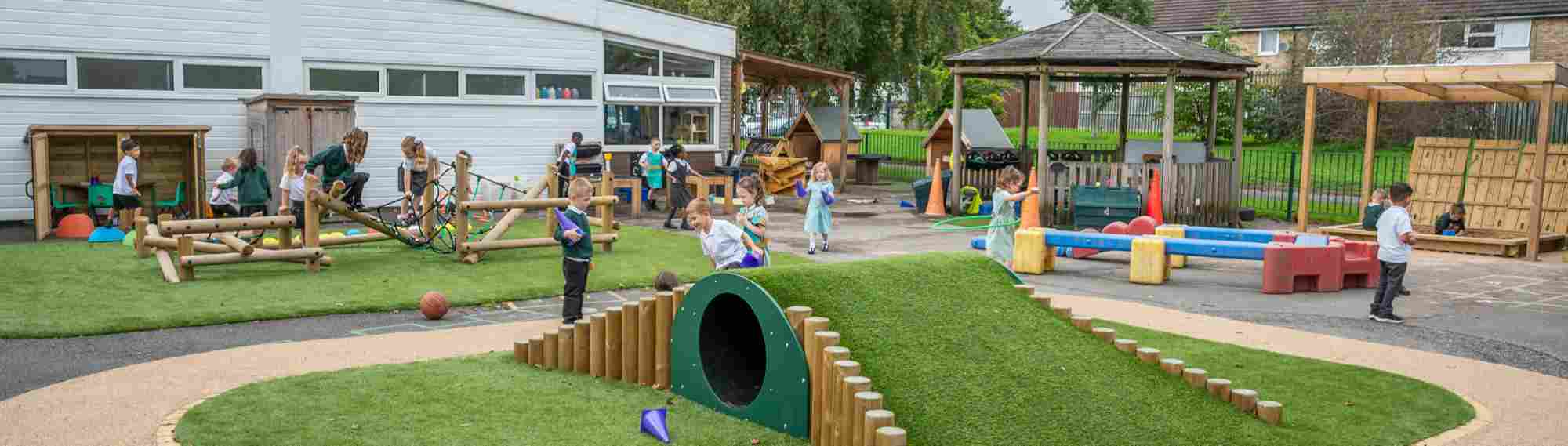 Pupils playing in the Moss Valley Primary Academy outdoor areas
